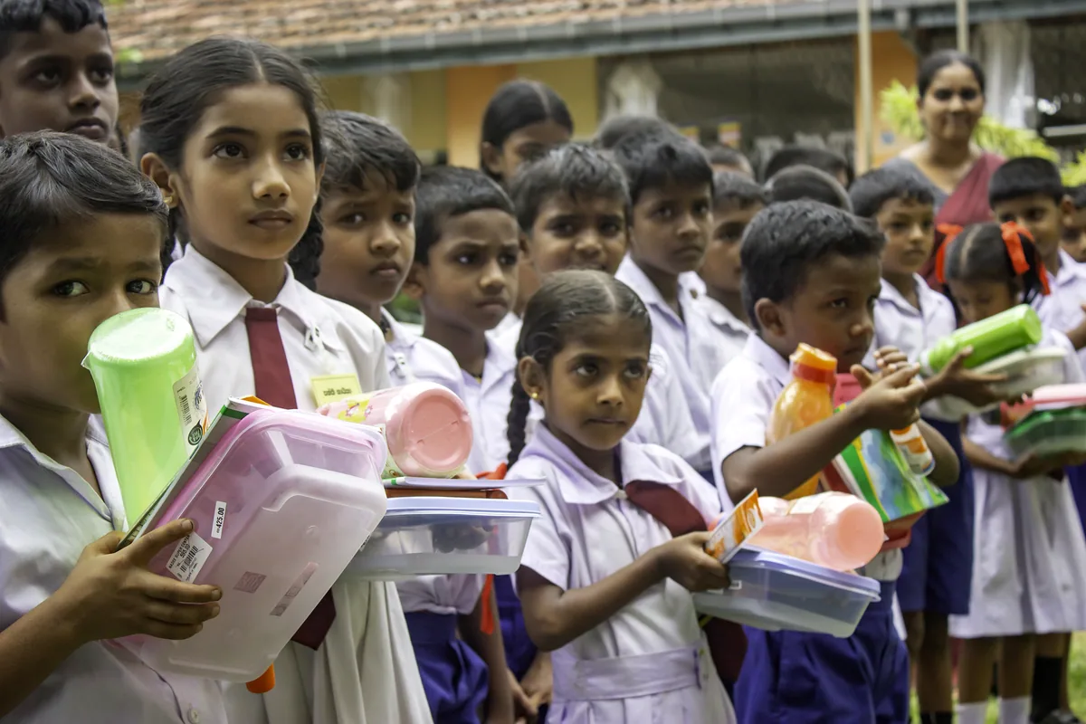 GCH children smiling lunch boxes school supplies Sri Lanka